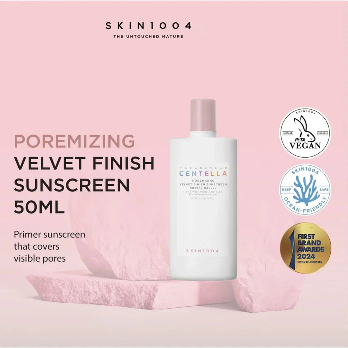 SKIN1004 poremizing velvet finish sunscreen bottle on a pink background with branding and certification logos.